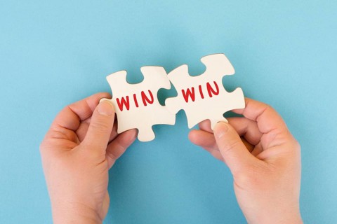 The word win is standing on puzzle parts, problem solving, winner mindset, business and education