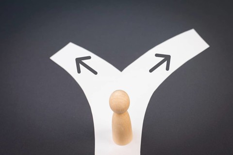 Tanding on a junction, choosing a direction, new oppurtunity, decision making concept, following a