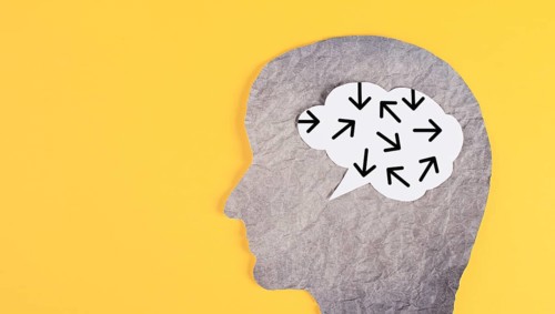 Think different, yellow background, head with brain, being a nonconformist, standing out from the