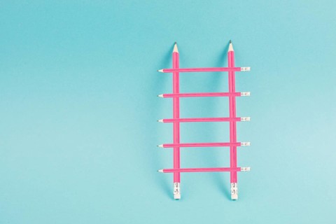 Ladder of success build with pencils, opportunity strategy, blue background, copy space for text,