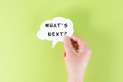 The phrase whatÂ´s next is standing on a cloud shaped paper, having new goals and strategies,