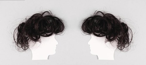 Silhouette of two faces with hair looking to each other, communication, having an opinion and