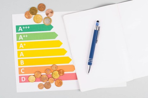 Empty paper, Euro money coins, power consumption grafic, increasing electricity costs, green