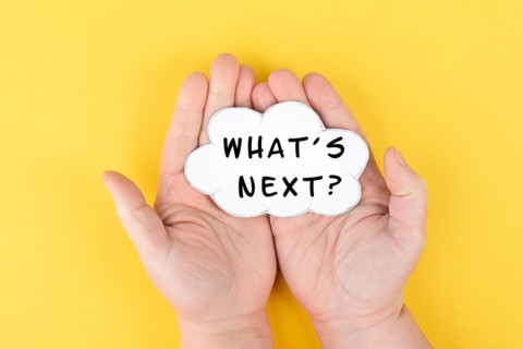 The phrase whatÂ´s next is standing on a cloud shaped paper, having new goals and strategies,