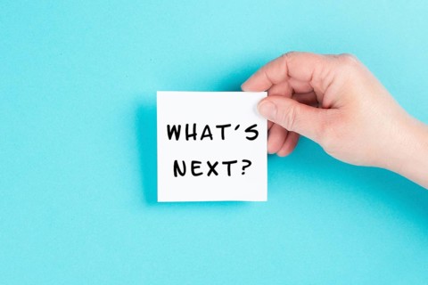 The phrase whatÂ´s next is standing on a cloud shaped paper, having new goals and strategies,