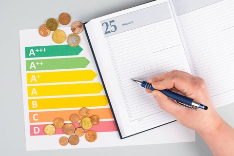Empty paper, Euro money coins, power consumption grafic, increasing electricity costs, green