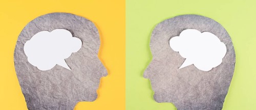 Silhouette of two faces, speech bubble in white color, copy space for text, communication, having