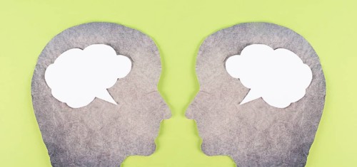 Silhouette of two faces, speech bubble in white color, copy space for text, communication, having