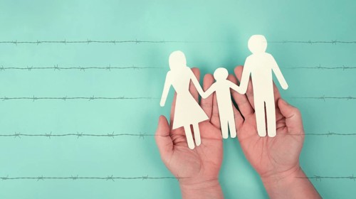 Immigration, refugees from Ukraine, asylem seekers, immigrants, silhouette of a family behind a