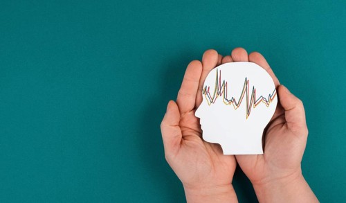 Holding a head in the hands, mental health concept, alzheimer and epilepsy disorder, brain waves,