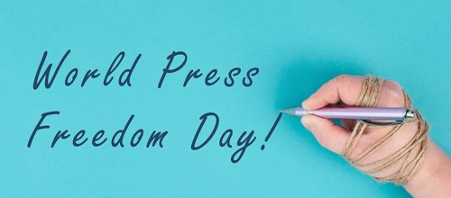 World Press Freedom Day is standing on a paper, hand with pen is chained, free speech, cancel