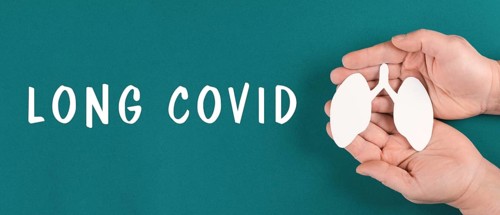 The words long covid are standing on a paper, hands hold a lung, breathing problems after Covid-19