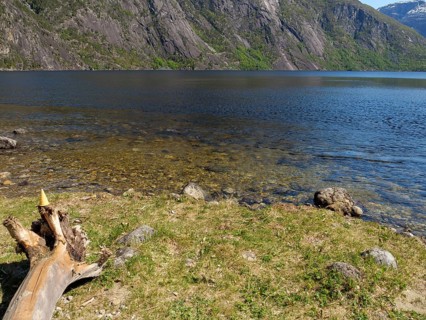 Lake with clear water, surrounded by rocks and mountain landscapes, Eidfjörd, Norway, Scandinavia,