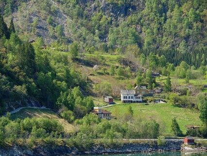 Rural houses in a green hilly landscape by the water, Eidfjörd, Norway, Scandinavia, Europe