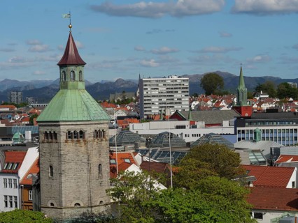 Cityscape with historic and modern buildings, a tower and Bergen in the background, Stavanger,