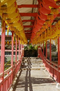 A corridor with red structures and hanging lanterns, arranged in steps, Pattaya, Thailand, Asia