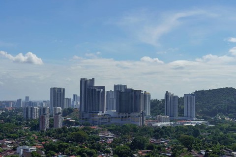 Modern cityscape with tall skyscrapers under a sky with light clouds, Pattaya, Thailand, Asia