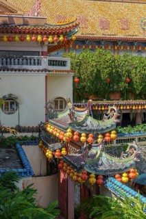 Detail of traditional Chinese architecture with lanterns and green vegetation, Pattaya, Thailand,