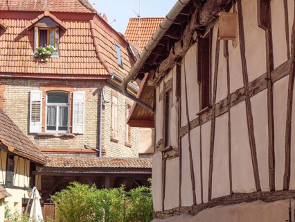 Traditional half-timbered houses with wooden beams and old windows in a historic neighbourhood,
