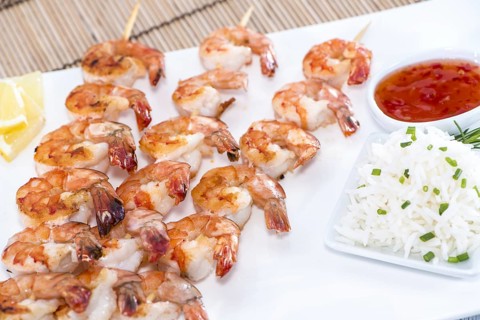 Skewered Tiger Prawns with a portion of fresh Rice