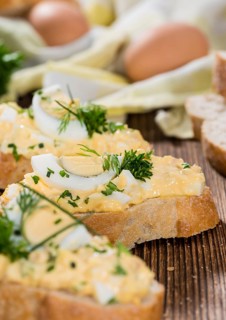 Portion of fresh homemade Egg Salad with fresh herbs