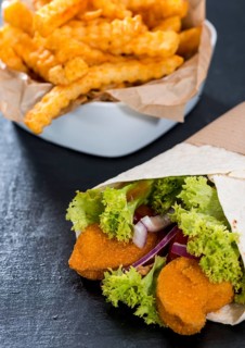Wrap with fresh fried Chicken pieces and a portion of chips