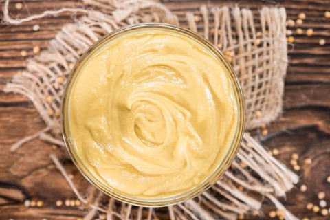 Small bowl with Mustard sauce (close-up shot)
