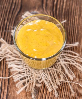 Portion of Curry Sauce on vintage wooden background