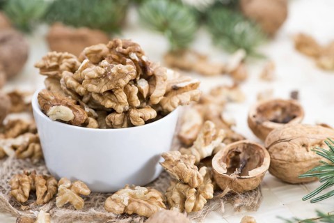 Heap of fresh Walnuts (close-up shot)