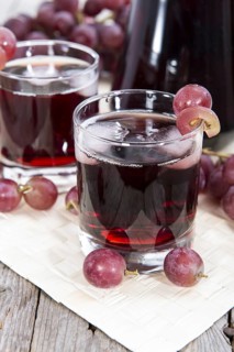 Glass with Grape Juice and fresh fruits