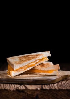 Fresh made Cheese Sandwich (selective focus) on an old wooden table