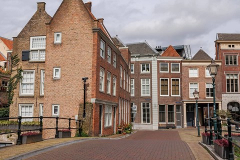 Cobbled streets lined with brick houses with historic facades and street lamps, Dordrecht, holland,