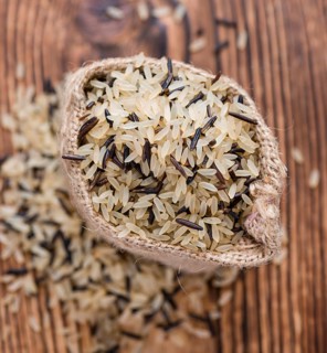 Portion of Mixed Rice (close-up shot) on wooden background
