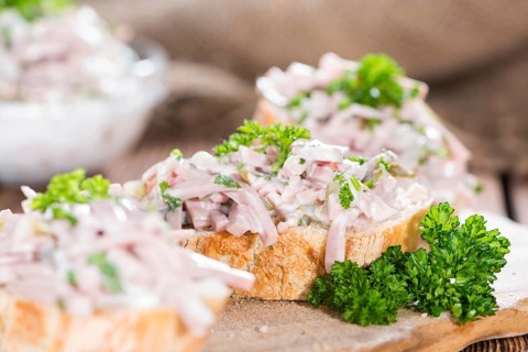Bread and Meat Salad (made with Mayonnaise and fresh parsley) on wood