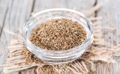 Heap of dried Aniseed (Pimpinella Anisum) on vintage background