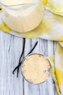 Fresh made Vanilla Milk (close-up shot) on wooden background