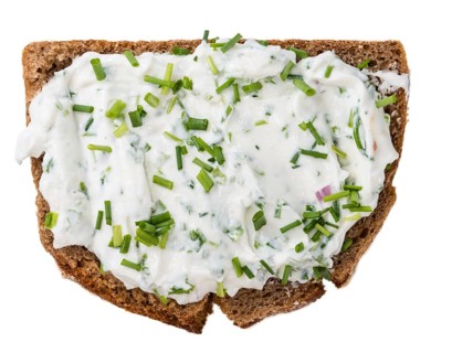 Slice of Bread with Herb Curd isolated on white background