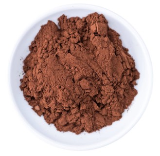 Portion of Cocoa powder (selective focus) as detailed close-up shot isoalted on white background