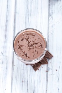 Fresh made Chocolate Milk on a bright wooden background