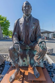 Bogense on the Kattegat, monument to the seated poet Hans Christian Andersen, fairytale figures,