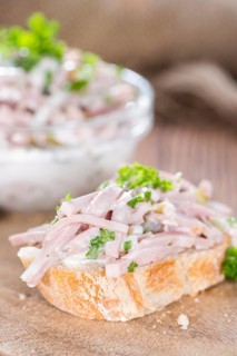Piece of bread with Meat Salad (detailed close-up shot)