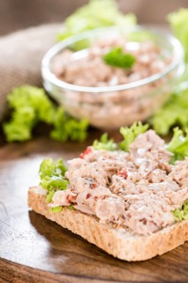 Fresh made Tuna salad sandwich on rustic wooden background