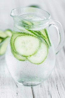 Cucumber Water on a vintage background as detailed close-up shot, selective focus