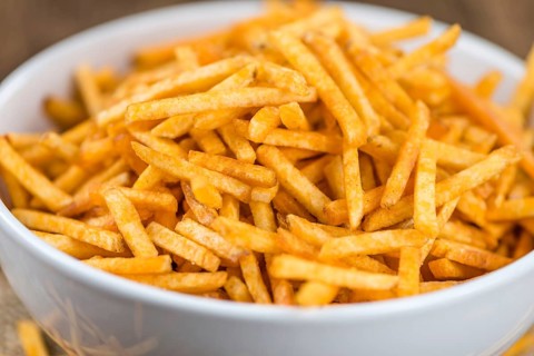 Portion of fried potato sticks (close-up shot, selective focus)