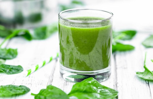 Freshly made spinach smoothie (detailed close up shot, selective focus)