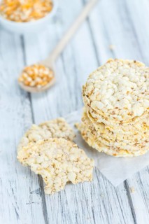 Fresh made Corn Waffles (close-up shot, selective focus) on vintage wooden background