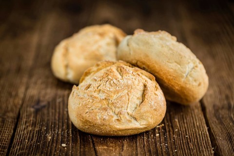 Fresh made German Buns on a vintage background as detailed close-up shot