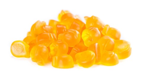 Gummy Peaches (close-up shot) isolated on white background
