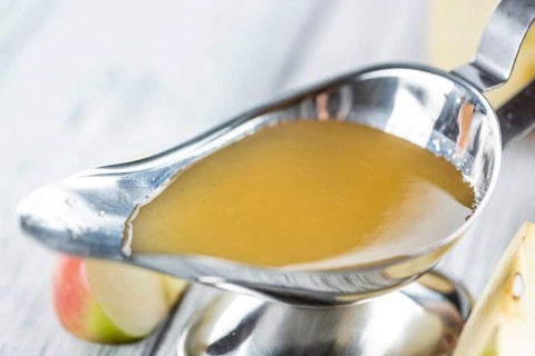 Portion of Applesauce (selective focus) on vintage background (close-up shot)