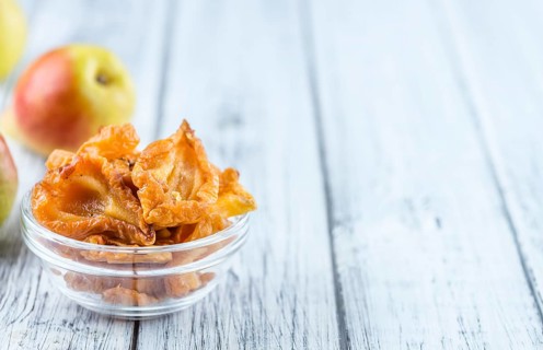 Some dried Pears (selective focus, close-up shot) on wooden background